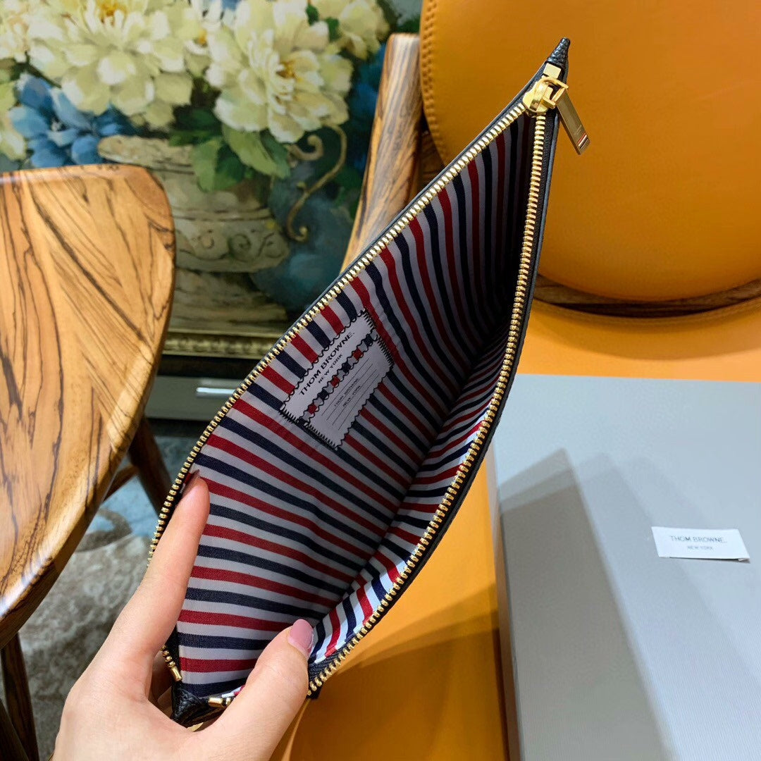 Three-color woven clutch bag